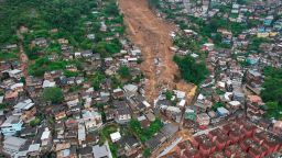 An aerial view shows a neighborhood affected by landslides in Petropolis, Brazil, Wednesday, Feb. 16, 2022. Heavy rains set off mudslides and floods in a mountainous region of Rio de Janeiro state, killing multiple people, authorities reported. (AP Photo/Silvia Izquierdo)