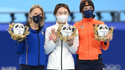 Choi (C), Fontana (L), and Schulting pose during the medal ceremony.