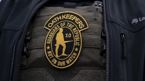 A demonstrator wears an Oath Keepers anti-government organization badge on a protective vest during a protest in Washington, DC on Jan. 5, 2021.
