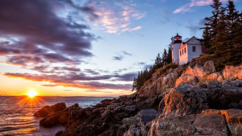 The Bass Harbor Lighthouse is seen at sunset at Acadia National Park in Maine.