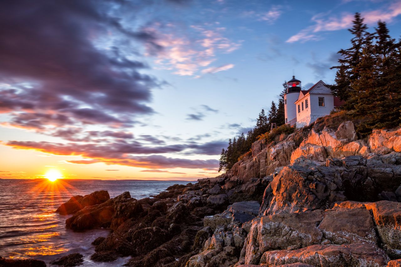 The Bass Harbor Lighthouse is seen at sunset at Acadia National Park in Maine.