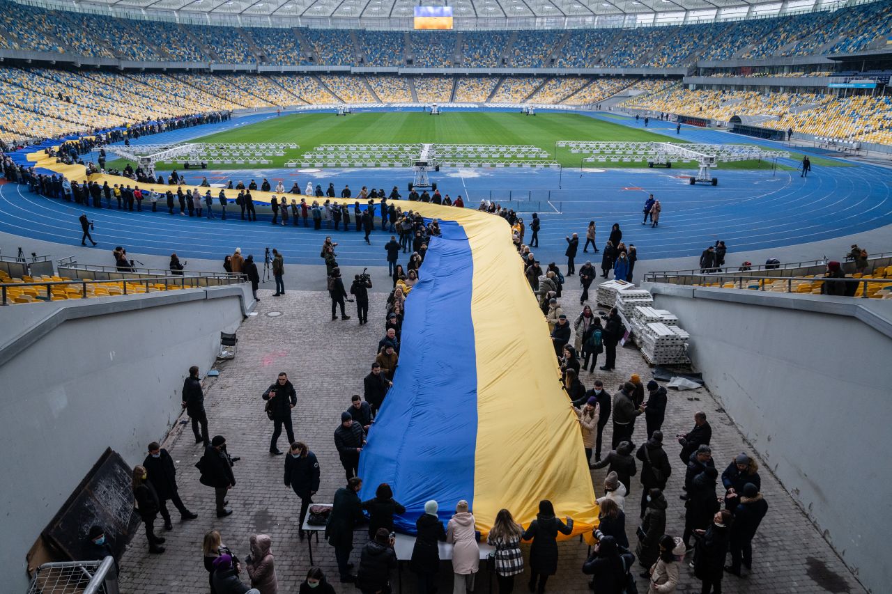 A 200-meter-long Ukrainian flag is unfolded at the Olympic Stadium in Kyiv on February 16 to mark a 