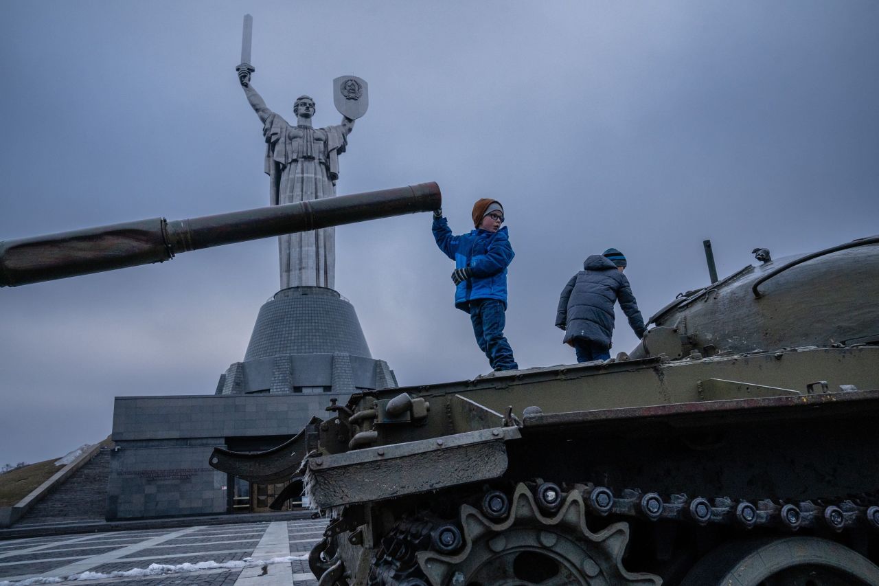 Children play on old Soviet tanks in front of the Motherland Monument in Kyiv on February 16.  Zelensky says Russia waging war so Putin can stay in power &#8216;until the end of his life&#8217; w 1280