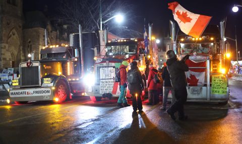 Trucks and protesters block downtown streets near Canada's Parliament on Tuesday, February 15.