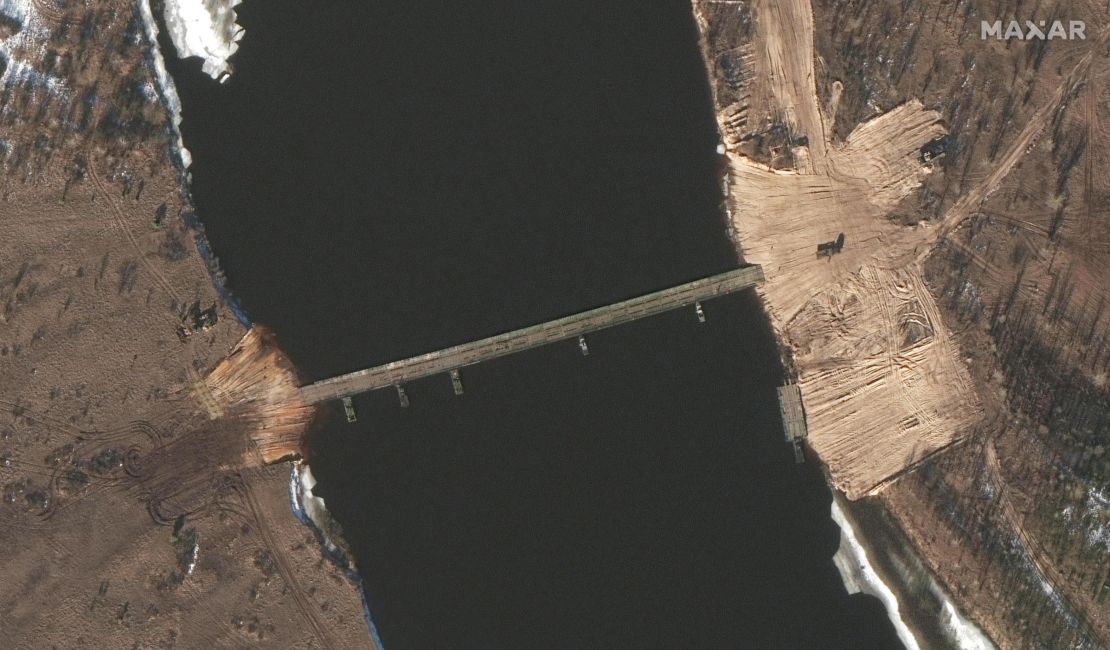 Satellite images taken over the past two days show new road construction and a tactical bridge being built across a key river in Belarus less than four miles from the Ukrainian border.