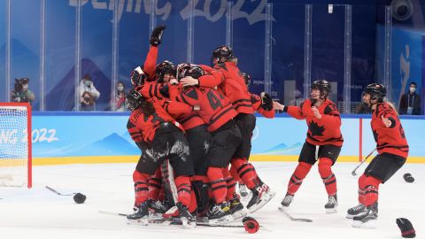 Team Canada celebrates its win over Team USA in the women's ice hockey gold medal match.