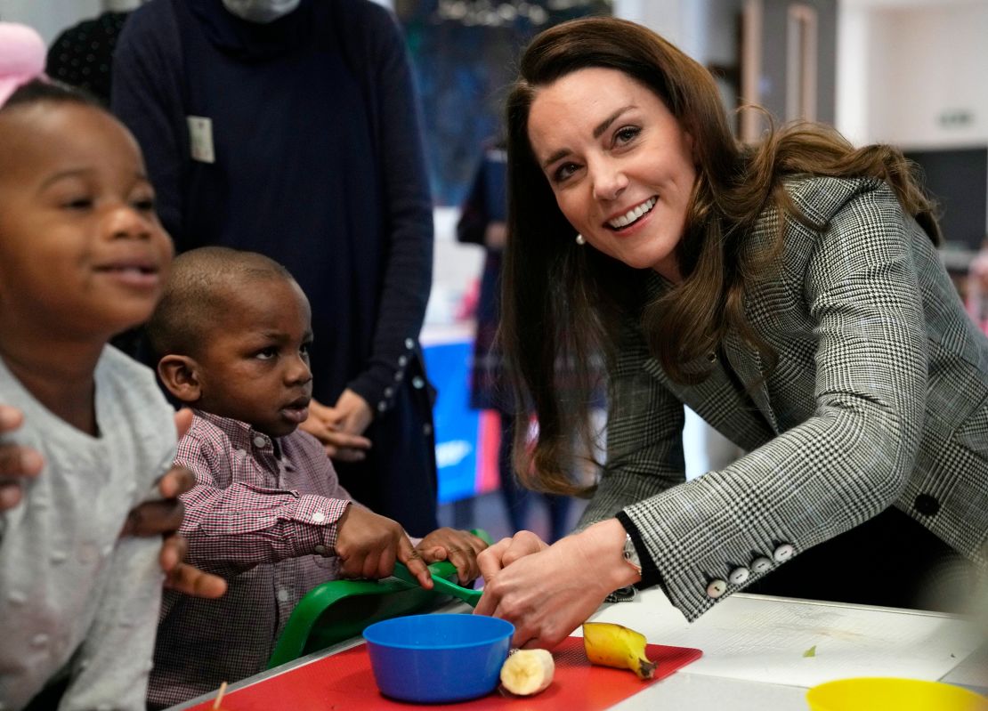 Catherine plays with children during a cooking workshop at PACT (Parents and Children Together) in London on February 8. 