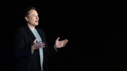 Elon Musk gestures as he speaks during a press conference at SpaceX's Starbase facility near Boca Chica Village in South Texas on February 10, 2022. Billionaire entrepreneur Elon Musk delivered an eagerly-awaited update on SpaceX's Starship, a prototype rocket the company is developing for crewed interplanetary exploration. 