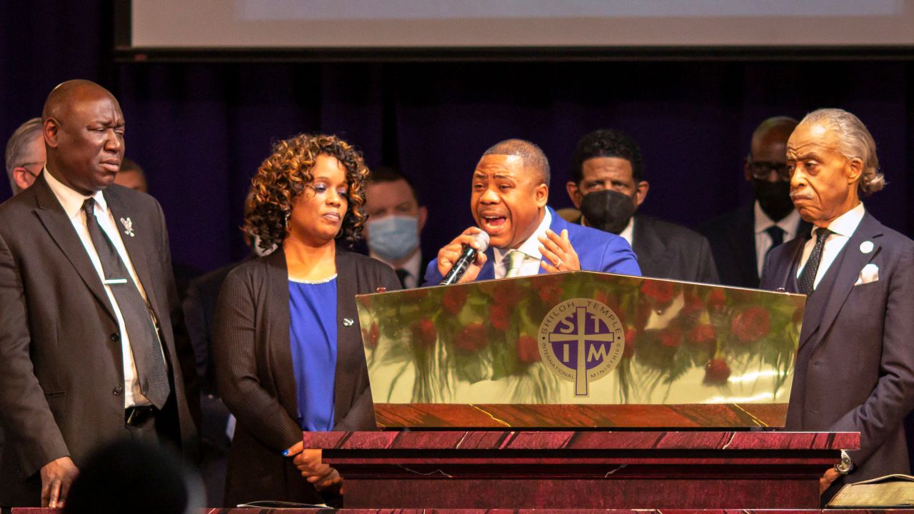 Andre Locke, center, and Karen Wells, second left, parents of Amir Locke, attorney Ben Crump and Rev. Al Sharpton attend the funeral of Amir Locke at the Shiloh Temple International Ministries in Minneapolis, February 17, 2022.