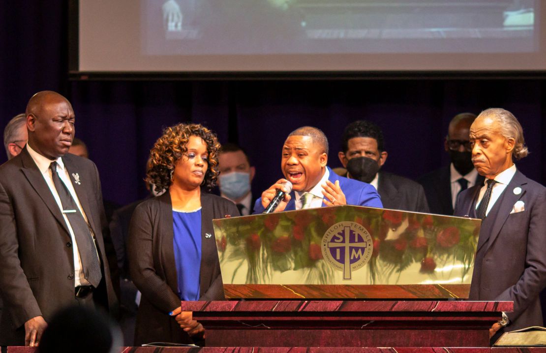 Andre Locke, center, and Karen Wells, second left, parents of Amir Locke, attorney Ben Crump and Rev. Al Sharpton attend the funeral of Amir Locke at the Shiloh Temple International Ministries in Minneapolis, February 17, 2022.