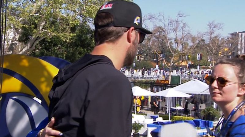 Matthew Stafford turns away as Rams parade photographer falls