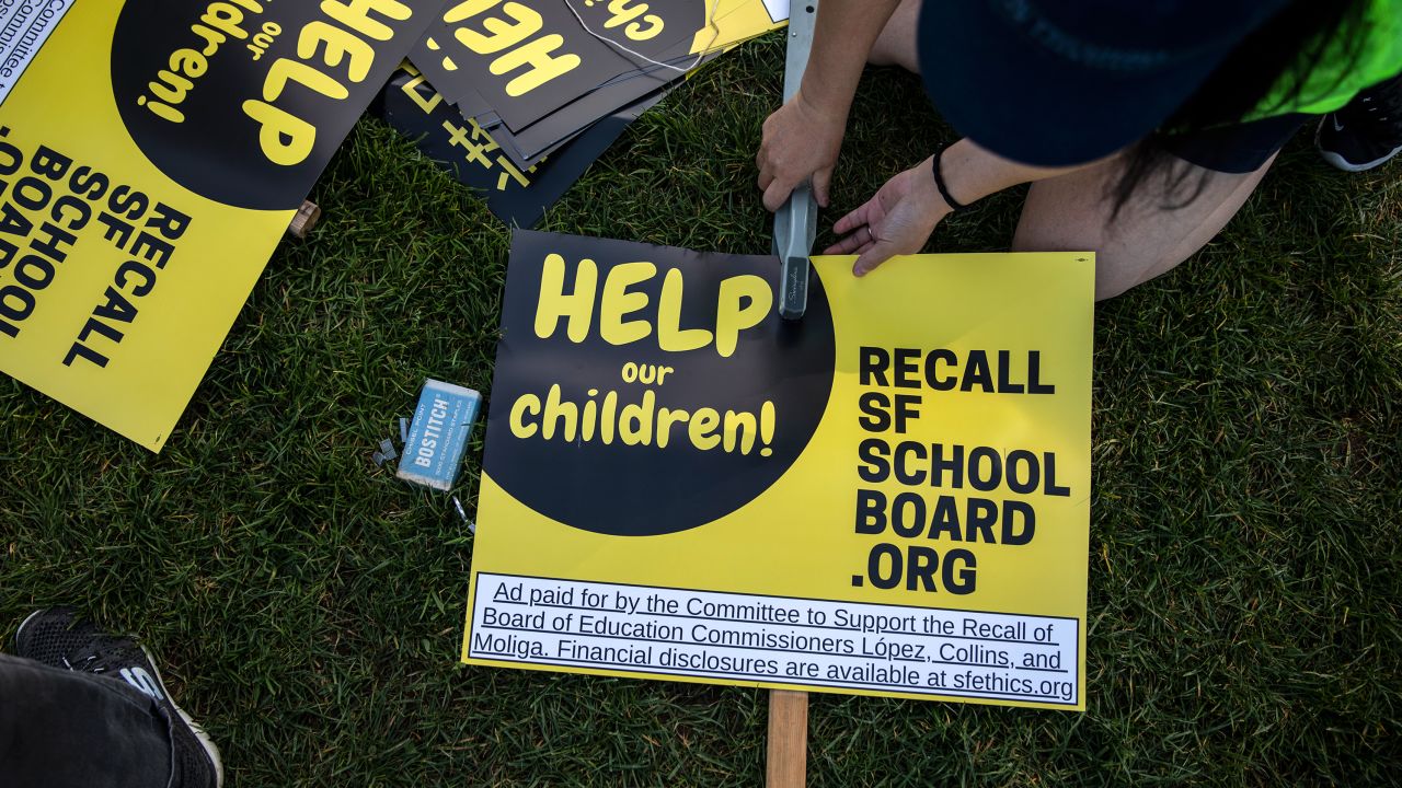 Michelle Wong makes a sign during a rally in support of the San Francisco School Board recall at Carl Larsen Park in San Francisco on February 12, 2022. 