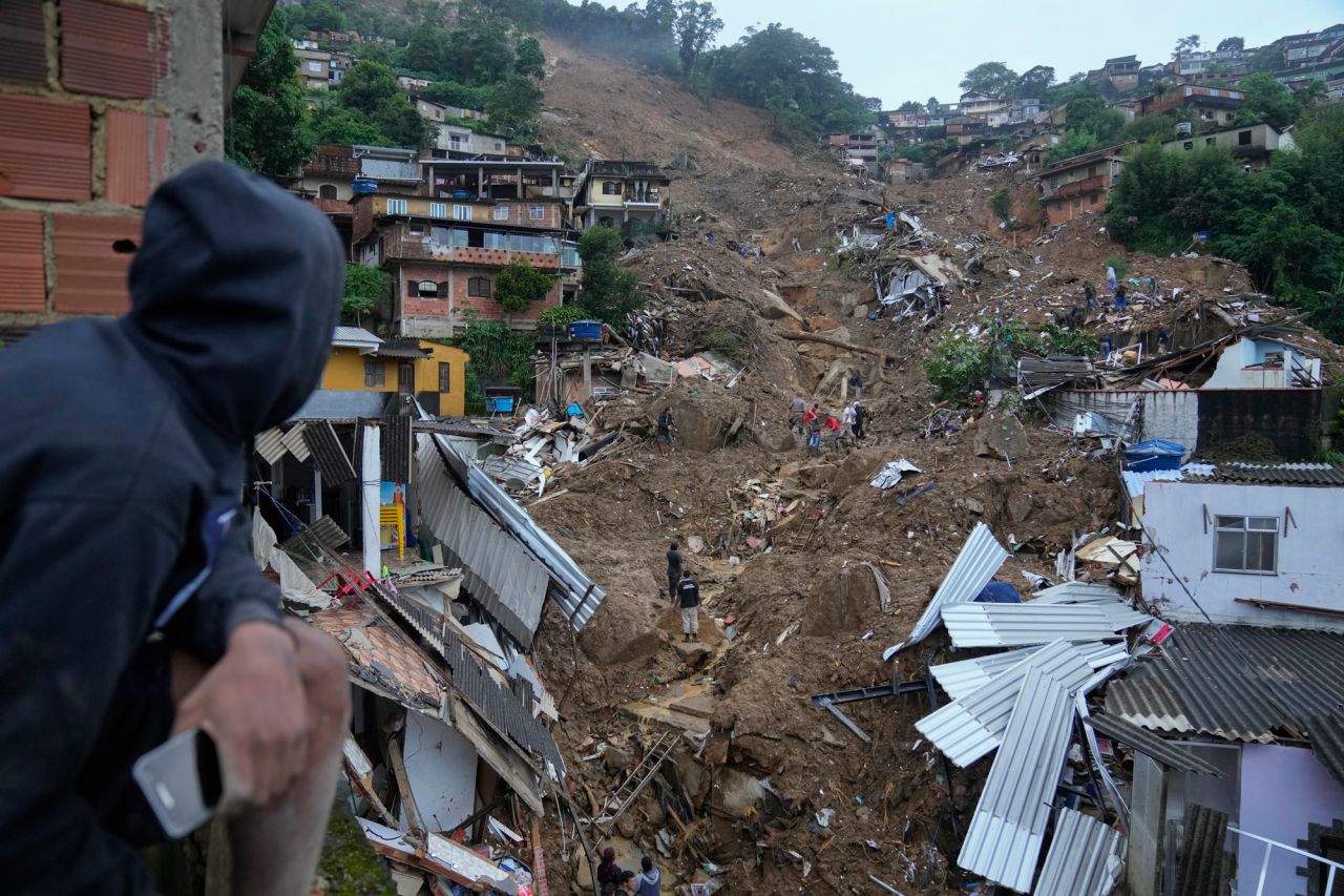 Rescue workers and residents search for victims in a landslide-affected area of Petropolis, Brazil, on Wednesday, February 16. At least 110 people have died in Petropolis after <a href="http://www.cnn.com/2022/02/17/world/gallery/brazil-landslides/index.html" target="_blank">heavy rains triggered landslides</a> that washed out streets, swept away cars and buried homes.
