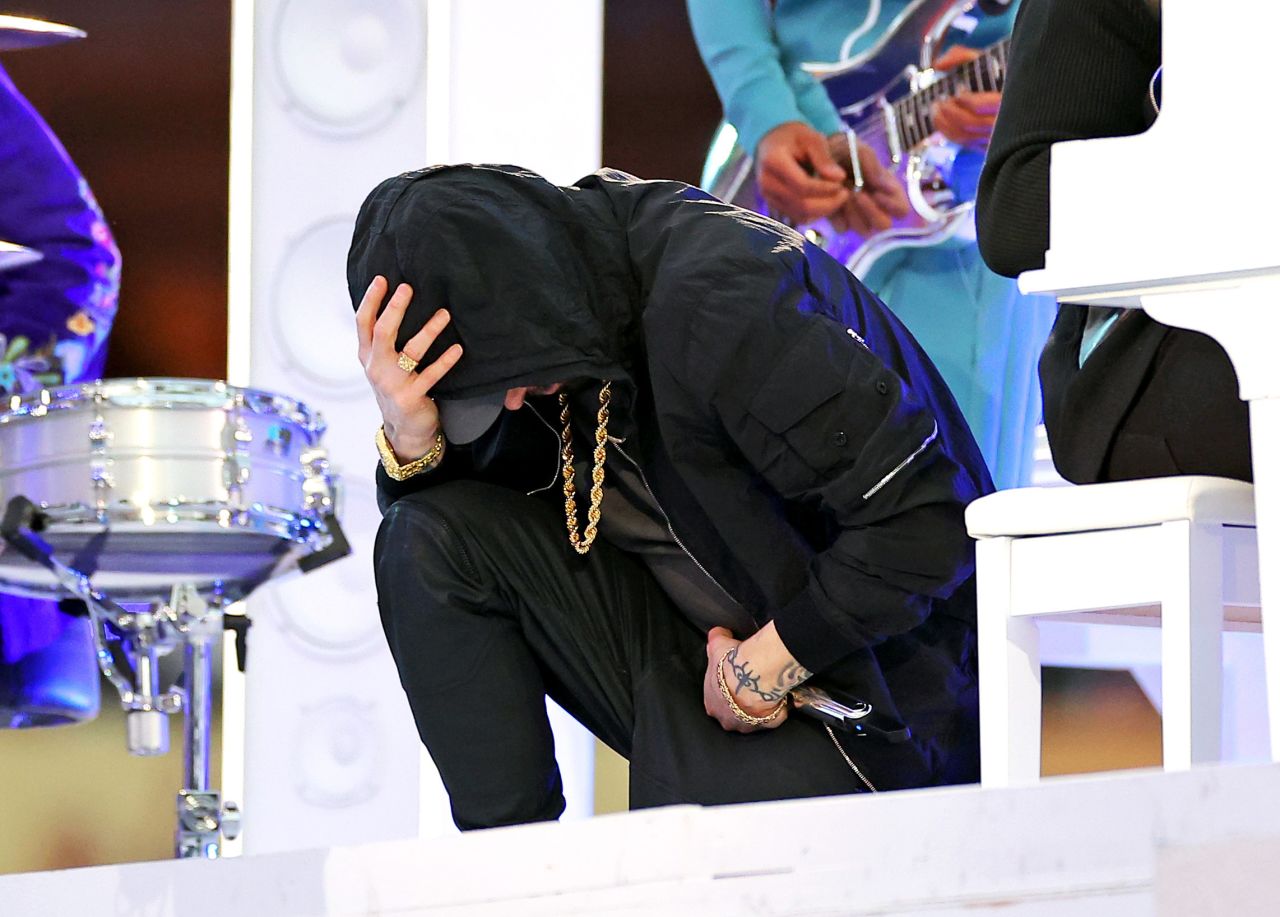 Rapper Eminem <a href="https://www.cnn.com/2022/02/16/entertainment/dre-eminem-super-bowl/index.html" target="_blank">takes a knee</a> during the <a href="http://www.cnn.com/2022/02/13/entertainment/gallery/halftime-show-photos-super-bowl-lvi/index.html" target="_blank">Super Bowl halftime show</a> on Sunday, February 13. The gesture was made famous by former NFL quarterback Colin Kaepernick as a way to protest police brutality and racial discrimination.