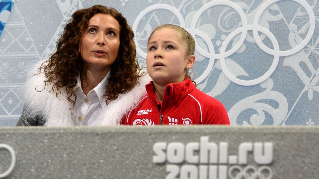 Yulia Lipnitskaia (R) and her coach Eteri Tutberidze during the Sochi Winter Olympics on February 20, 2014. 