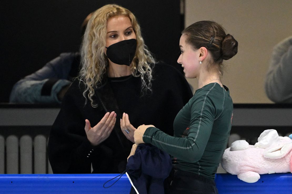 Kamila Valieva (R) and Eteri Tutberidze attend a training session on February 12, 2022.