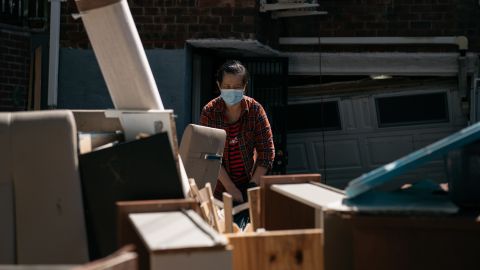 New York City residents sort through damaged and destroyed items after a night of deadly flooding from the remnants of Hurricane Ida in September 2021.