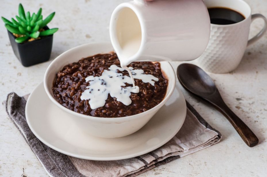 <strong>Champorado:</strong> Champorado is a cocolate-y rice porridge often topped with a swirl of milk (condensed or evaporated) and a smattering of tuyo -- small salted and dried silver fish.