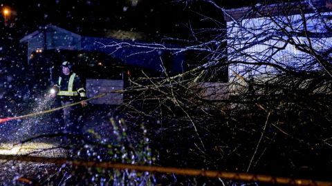 Emergency personnel survey a damaged mobile home after a possible tornado passed through on February 17 in Leeds, Alabama.