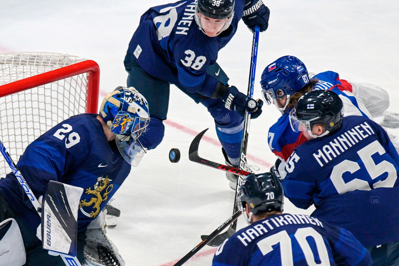 Finnish goalie Harri Säteri defends his net during a hockey semifinal against Slovakia on February 18. <a href="index.php?page=&url=https%3A%2F%2Fwww.cnn.com%2Fworld%2Flive-news%2Fbeijing-winter-olympics-02-18-22-spt%2Fh_a7387138de028d7e248d7f8cbed1075a" target="_blank">Finland won 2-0.</a>