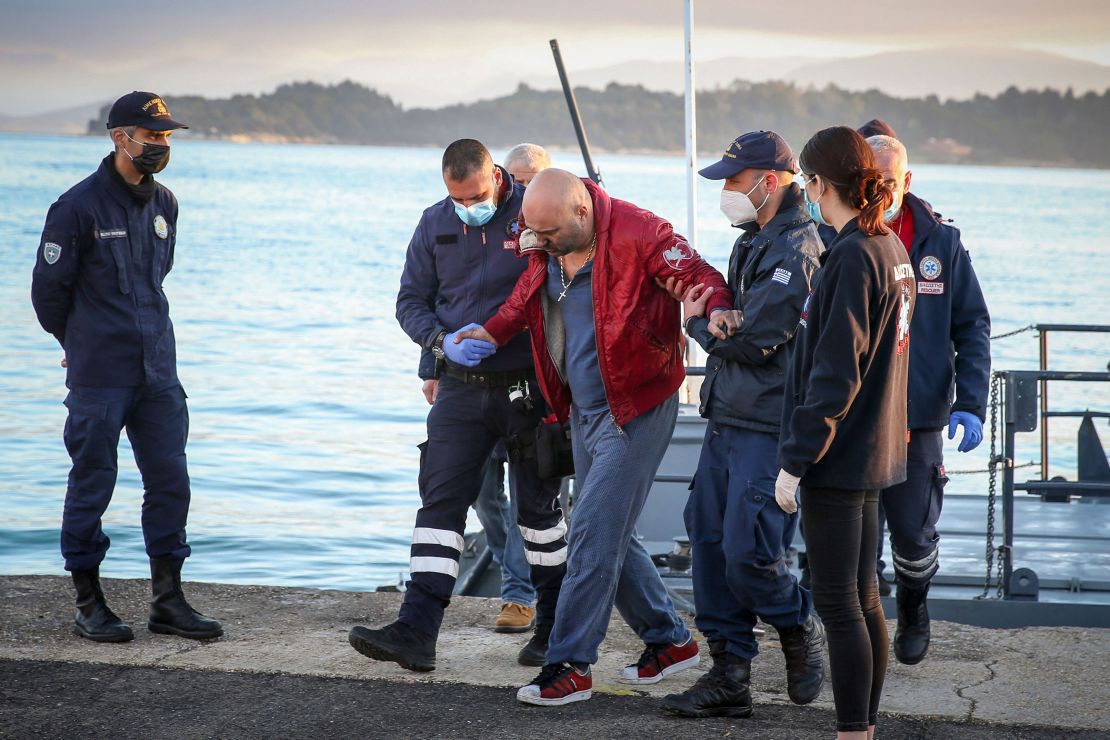 A rescued passenger arrives at the port of Corfu on Friday, after hundreds were evacuated from the ship.