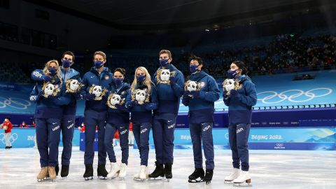 Silver medalists Team USA pose during the team event flower ceremony.