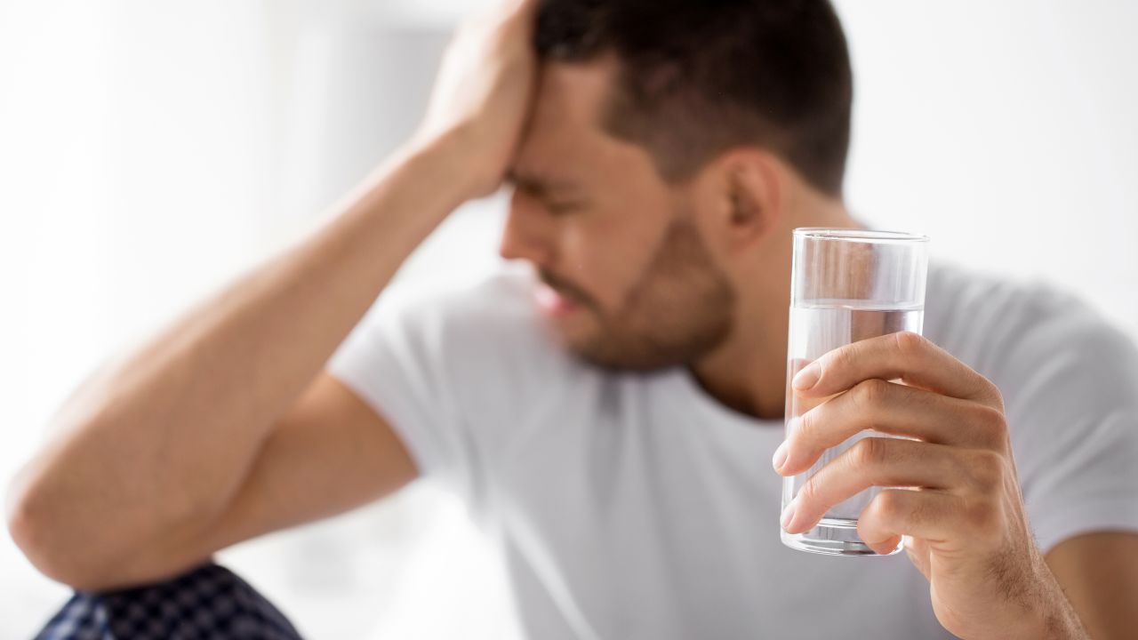Replacing lost fluids with water or a sports drink can help boost recovery from a hangover, experts say.