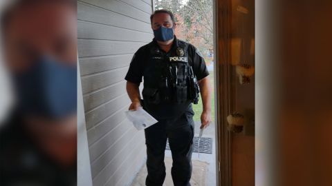 Nooksack Police Office Jeremy Hoyle arrives at one of the "Nooksack 63's" homes to serve eviction papers.