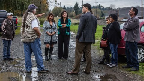 In this Nov. 6, 2015 photo, Seattle Lawyer Gabe Galanda, center, listens to Nooksack tribal members before a lunch meeting with some of the members who are facing disenrollment from the tribe on the Nooksack Reservation near Deming, Wash. Galnda has been fighting disenrollment for three years.