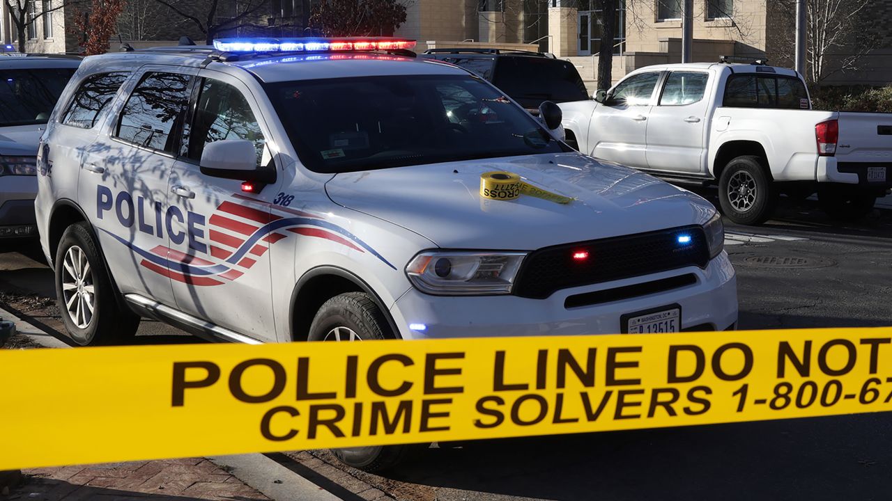 A Metropolitan Police Department of the District of Columbia police car is pictured at an entrance as an investigation of a security threat is being conducted at a school February 8, 2022.