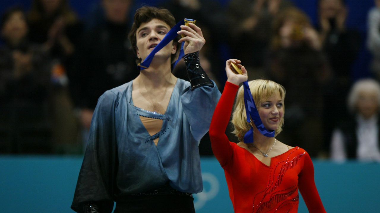 Elena Berezhnaya and Anton Sikharulidze of Russia celebrate gold at the Salt Lake City Winter Olympics.