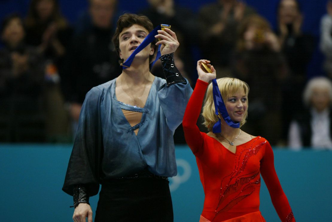 Elena Berezhnaya and Anton Sikharulidze of Russia celebrate gold at the Salt Lake City Winter Olympics.