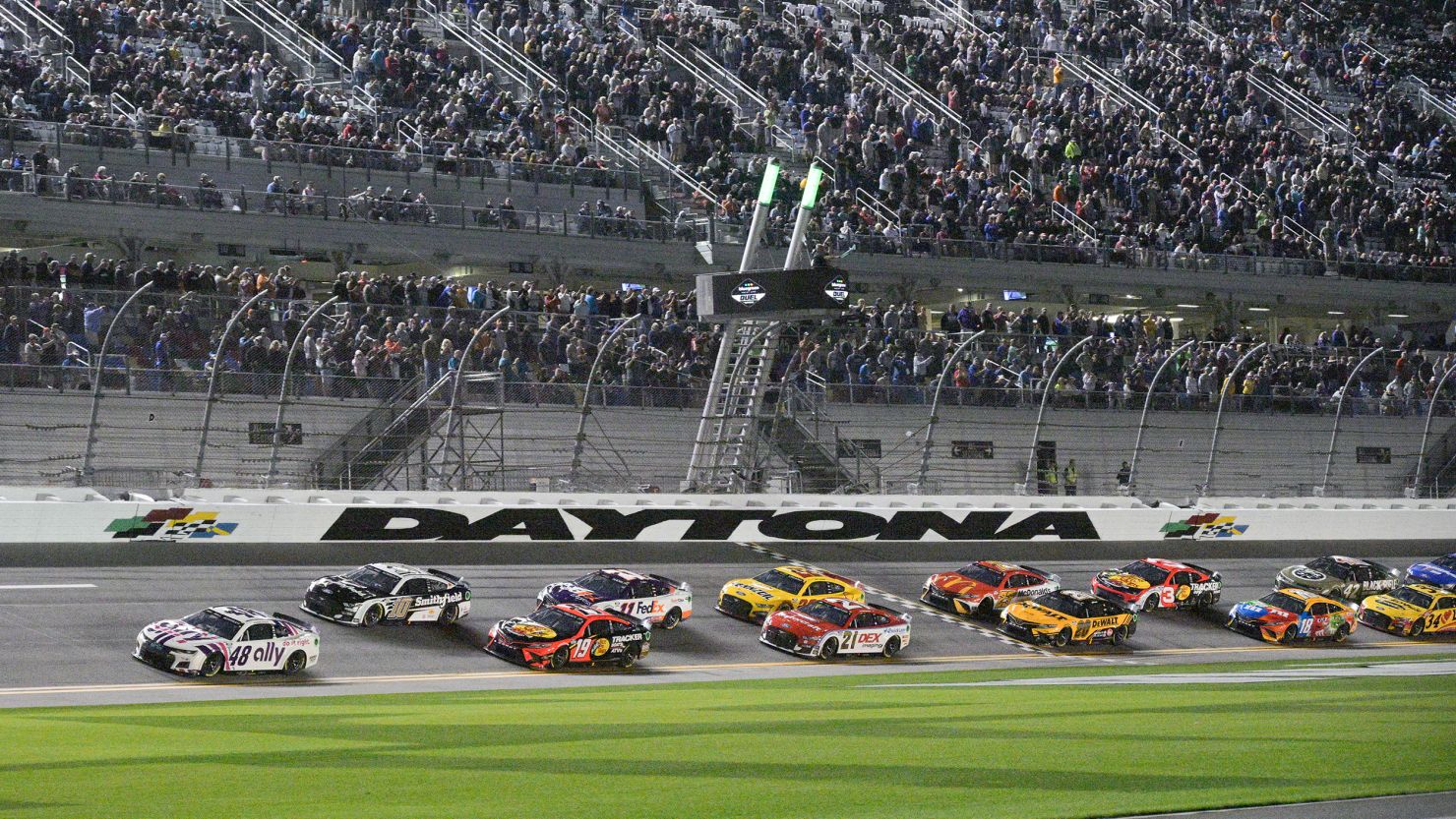 Cars take the green flag during the start of the second NASCAR Daytona 500 qualifying race. 
