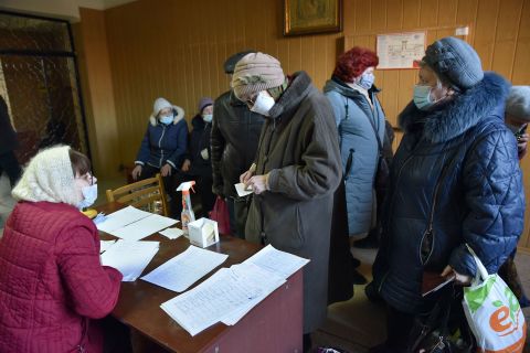 Residents of the breakaway Donetsk state sign up for evacuation to Russia on February 19. <a href=