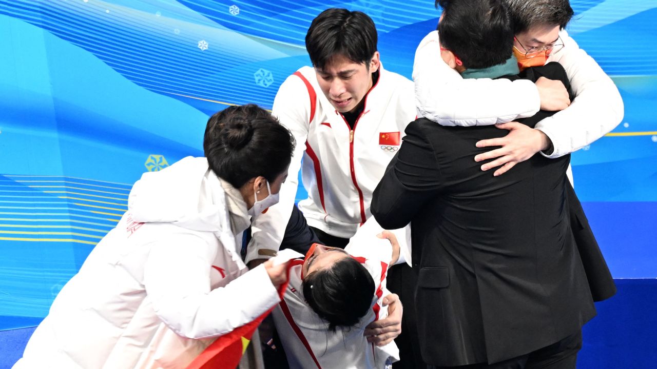 China's Sui Wenjing, second left, reacts to winning the pairs skating free skating gold medal with China's Han Cong during the Beijing 2022 Winter Olympic Games at the Capital Indoor Stadium in Beijing on February 19, 2022.