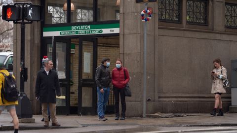 Commuters outside a subway station in downtown Boston, on Feb. 17, 2022.