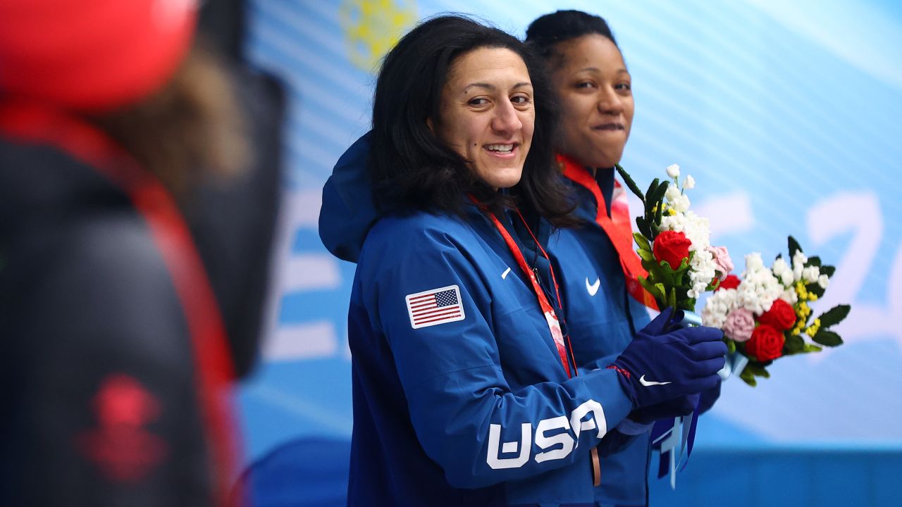 Meyers Taylor and Hoffman look on from the podium during the flower ceremony on Saturday.
