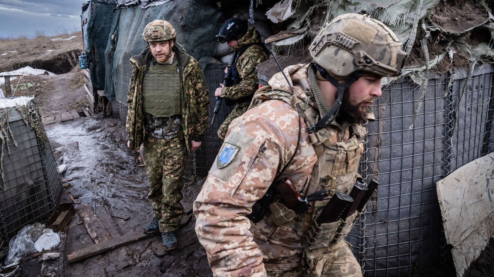 Ukrainian Interior Minister Denys Monastyrskiy, left, visits soldiers at a front-line position in Novoluhanske on February 19. Minutes after he left, <a href="index.php?page=&url=https%3A%2F%2Fwww.cnn.com%2Feurope%2Flive-news%2Fukraine-russia-news-02-19-22-intl%2Fh_d1ce9212df87ddbf0f79e4c4e4a6df56" target="_blank">the position came under fire.</a> No one was injured.