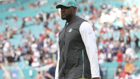 Miami Dolphins head coach Brian Flores stands on the field prior to an NFL football game against the New England Patriots, Sunday, Jan. 9, 2022, in Miami Gardens Fla. The Dolphins won 33-24. 