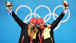 YANQING, CHINA - FEBRUARY 19: Gold medal winners Laura Nolte and Deborah Levi of Team Germany celebrate on the podium during the flower ceremony following the 2-woman Bobsleigh Heat 4 on day 15 of Beijing 2022 Winter Olympic Games at National Sliding Centre on February 19, 2022 in Yanqing, China. (Photo by Adam Pretty/Getty Images)