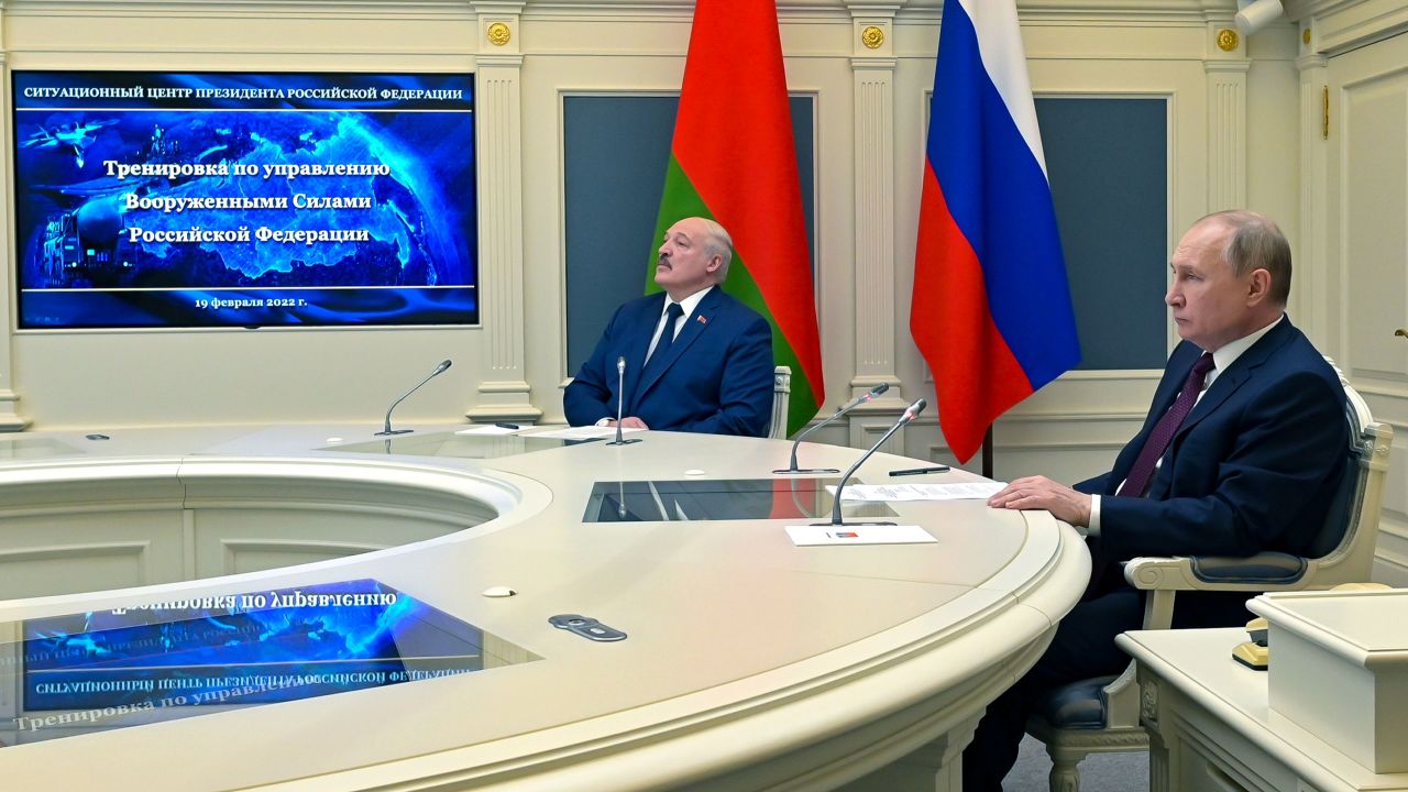 Russian President Vladimir Putin, right, and Belarusian President Alexander Lukashenko watch military drills via videoconference in Moscow, Russia, Saturday, Feb. 19, 2022.