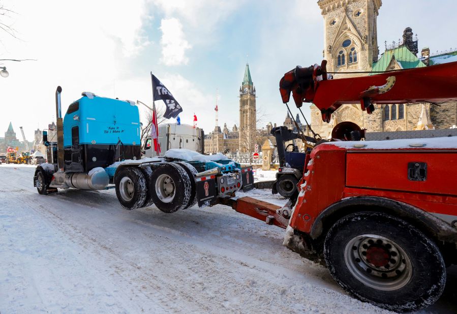 A truck is towed away in front of Ottawa's Parliament Hill on February 19.