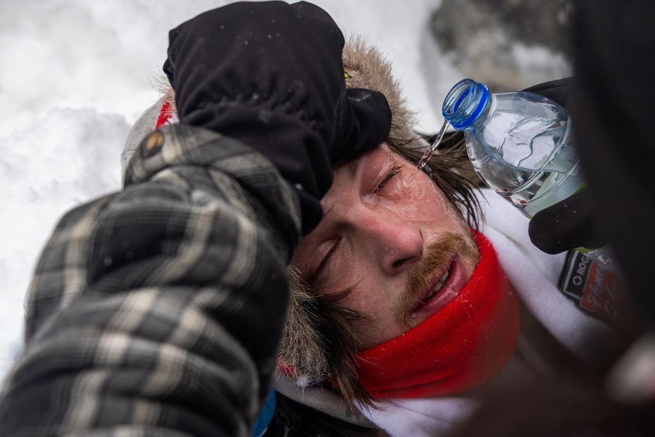 A protester's eyes are washed out after being affected by a chemical irritant fired by police on February 19.