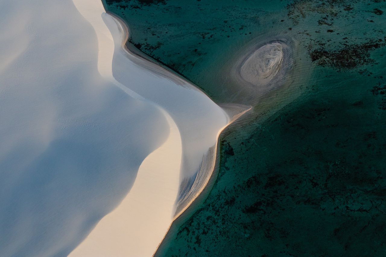 <strong>Land of contrasts:</strong> The sand and water make for a striking visual juxtaposition on the ground and from the air.