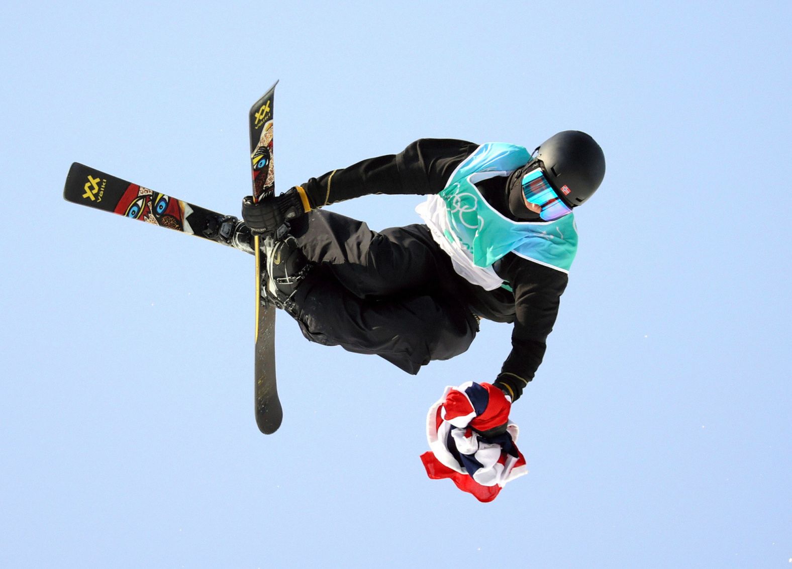 Knowing he had already clinched the gold in the big air competition, Norwegian freestyle skier Birk Ruud <a href="index.php?page=&url=https%3A%2F%2Fwww.cnn.com%2Fworld%2Flive-news%2Fbeijing-winter-olympics-02-09-22-spt%2Fh_e97aa9702edae900474c450be6ad01ed" target="_blank">holds his country's flag in his hand</a> as he completes his final jump on February 9.