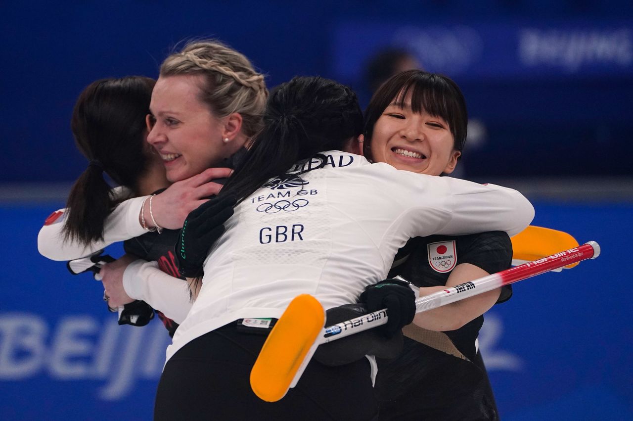 Athletes from both teams hug after the curling final between Japan and Great Britain on February 20. It was Great Britain's <a href="https://www.cnn.com/world/live-news/beijing-winter-olympics-02-20-22-spt/h_1e0312d42a548ef11313678be9a87b61" target="_blank">only gold medal</a> of these Olympics.