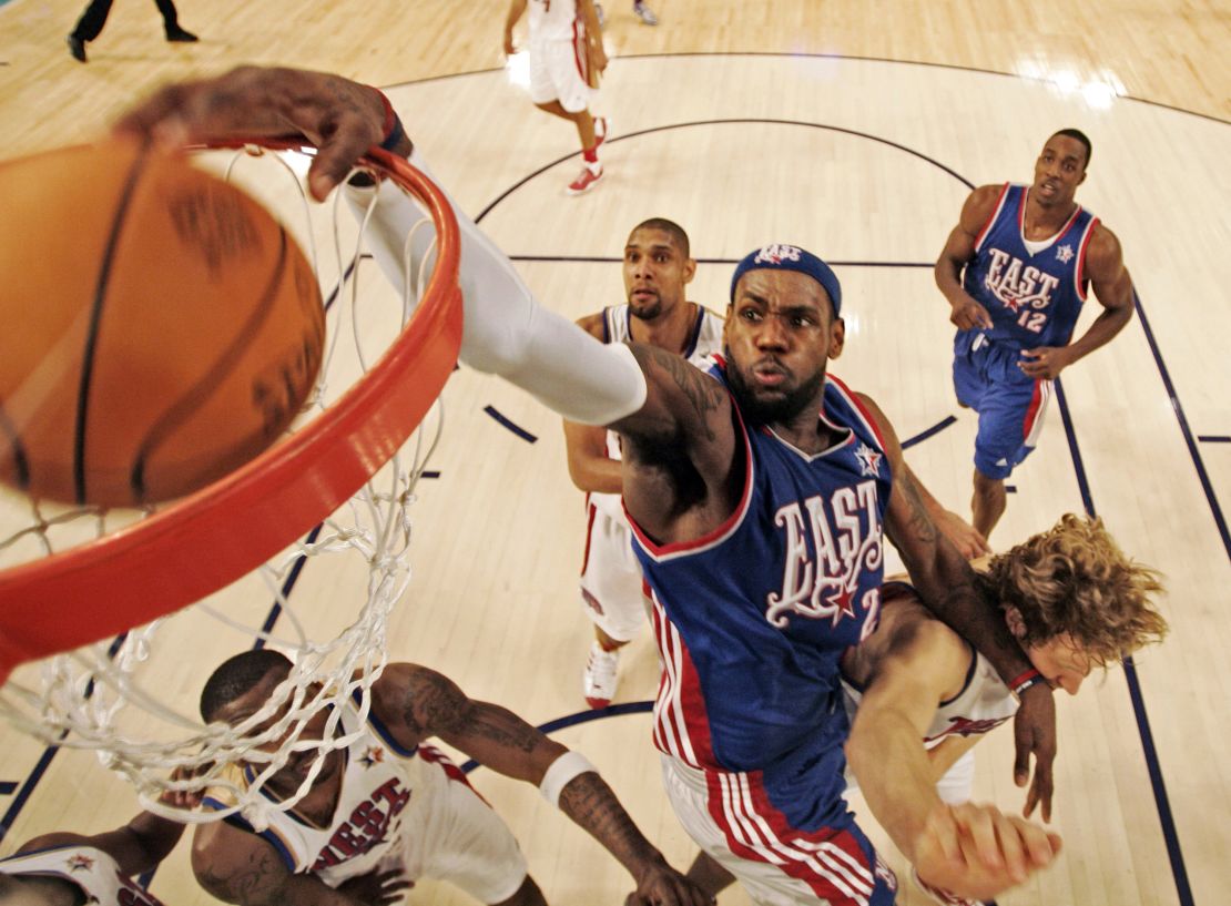 James, of the Cleveland Cavaliers, dunks over Dirk Nowitzki during the All-Star Basketball Game in 2008. 