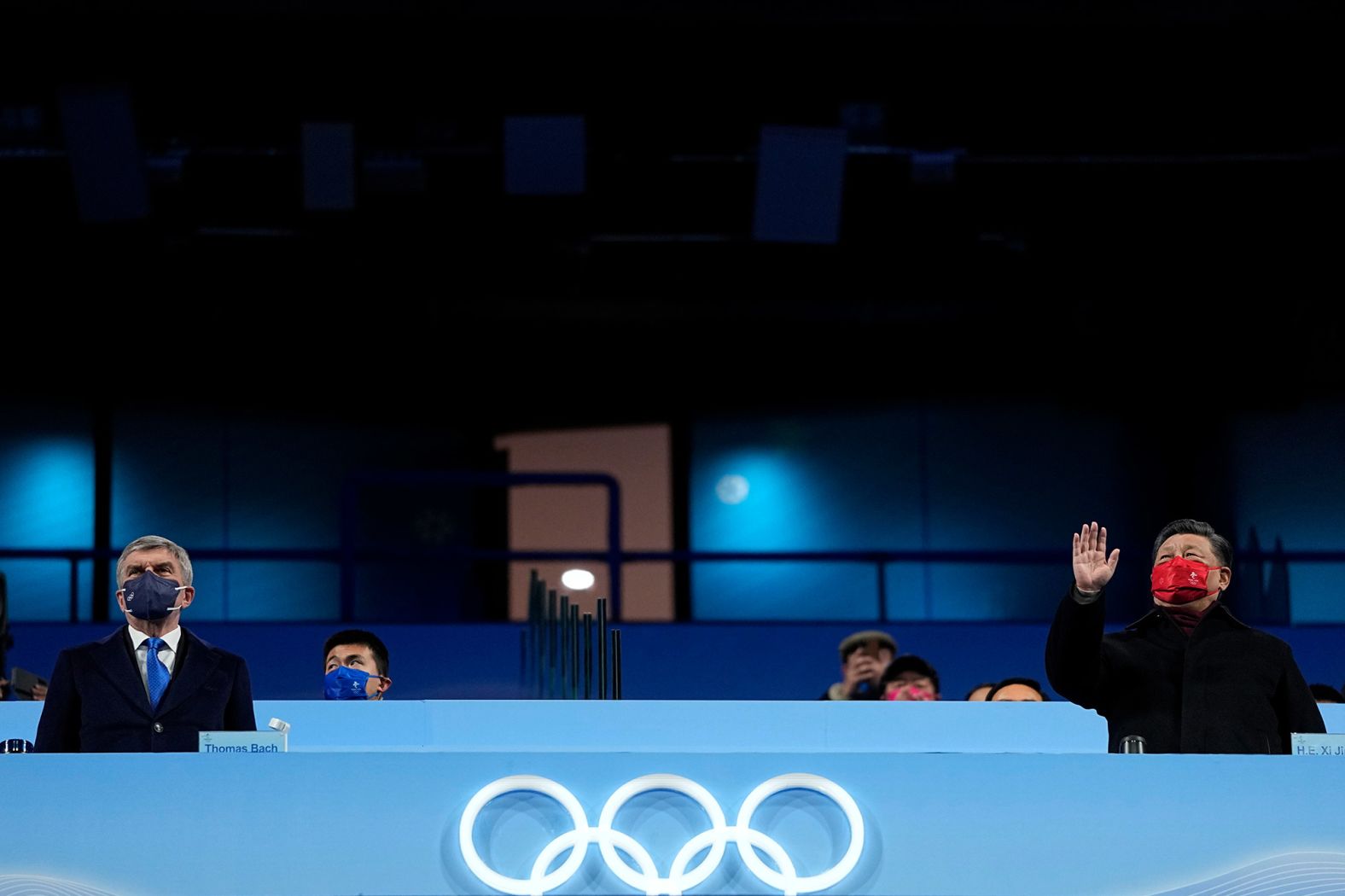 Bach, left, watches the closing ceremony next to Chinese President Xi Jinping.