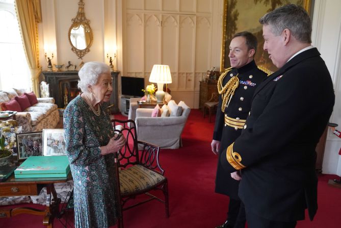 The Queen meets with Rear Admiral James Macleod, the outgoing Defence Services secretary, and Macleod's successor, Major General Eldon Millar, at Windsor Castle in February 2022. It was a few days before Buckingham Palace announced that the Queen <a href="index.php?page=&url=https%3A%2F%2Fwww.cnn.com%2F2022%2F02%2F20%2Fuk%2Fqueen-elizabeth-coronavirus-intl-gbr%2Findex.html" target="_blank">tested positive for Covid-19.</a>