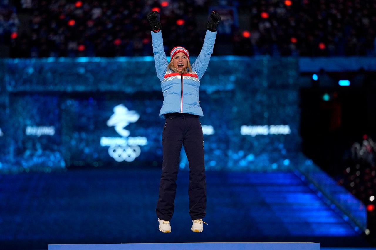 Therese Johaug, a cross-country skier from Norway, celebrates on a podium as she receives one of her gold medals during the closing ceremony. Johaug won three gold medals in Beijing, and <a href="https://www.cnn.com/world/live-news/beijing-winter-olympics-02-20-22-spt/h_7d87c55c1539e56df6b9f26224f5fb1f" target="_blank">this latest one</a> was for the mass start event that she won on Saturday.